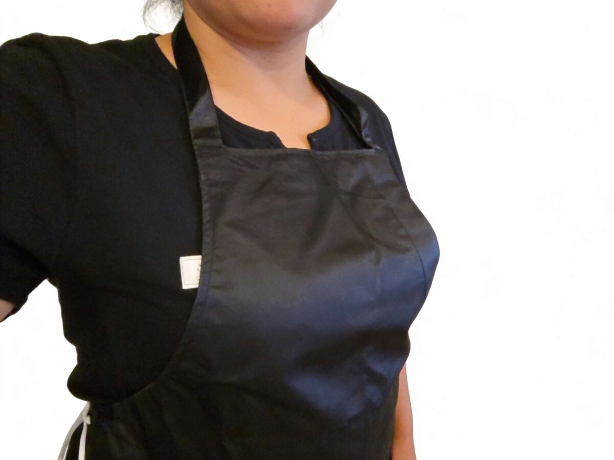 Black apron lifestyle no background